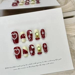Handmade Christmas press-on nails with red and white snowflake heart 3D art