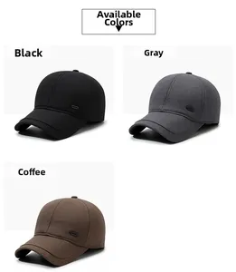 Close-up of baseball caps in black, grey, and brown with side decorative labels