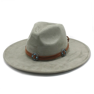 Detail of faux suede fedora featuring brown leather band with turquoise metal studs