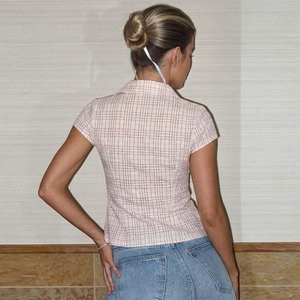 Back view of a pink plaid short-sleeve shirt with button-down collar and cotton texture
