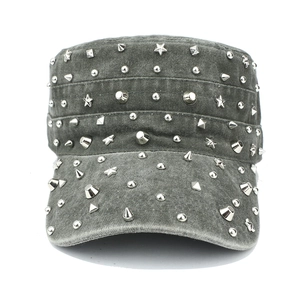 Detail of grey washed cotton military cap with assorted punk style silver metal studs
