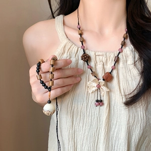 Ethnic jewelry set with beaded wooden necklace, woven flower pendant and bracelet