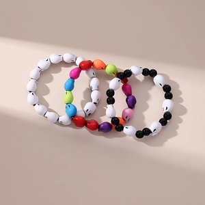 Set of 4 colorful acrylic skull beaded bracelets for Halloween gothic fashion accessory