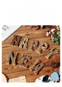 Macro detail of natural birch wood alphabet ornaments with rustic bark texture