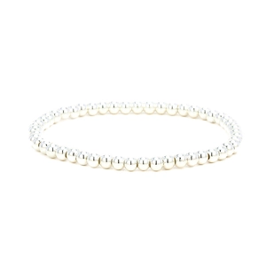 Detail of silver beaded stretch bracelet showing polished 18K plated metal beads