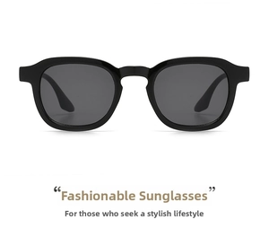 Close-up of retro black thick frame sunglasses with deep grey lenses on white background