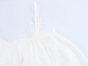 Detail of white lace shoulder straps and chiffon neckline on a sexy floral maxi dress