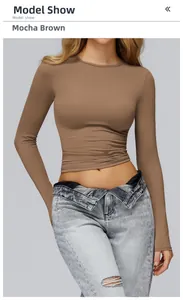 Detailed view of women's mocha brown long sleeve yoga top with slim fit knitted design