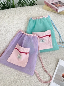 Lightweight mesh drawstring backpack in purple and mint green with front zipper pocket