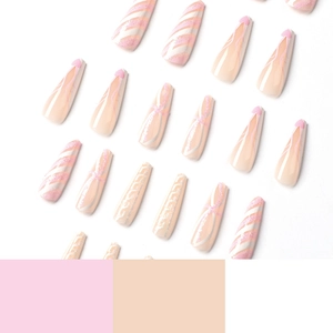 Pink and white coffin press-on nails with glitter swirls, lines and heart decorations