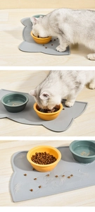 Detail of grey cat-shaped silicone mat with waterproof raised edges for pet feeding