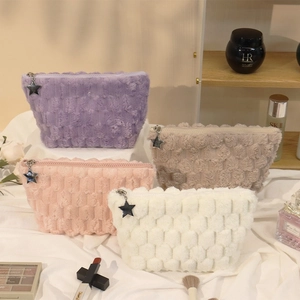 Plush checkerboard makeup bags in four colors with star zippers and textured fabric