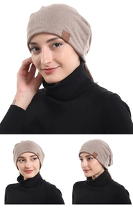 Soft cotton slouchy beanie hat for men and women in beige with leather label