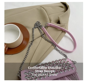 Pink rhinestone crossbody bag with elegant silver fringes and a stylish chain strap