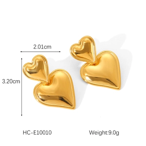 Detailed view of gold double heart earrings with 2.01cm width and 3.20cm height