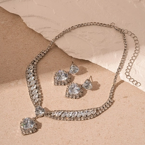 Luxury heart-shaped necklace and earring set with shimmering cubic zirconia and silver finish