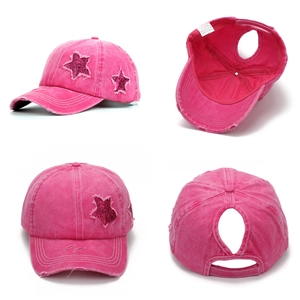 Detail view of pink washed cotton baseball cap with sequin star and ponytail hole