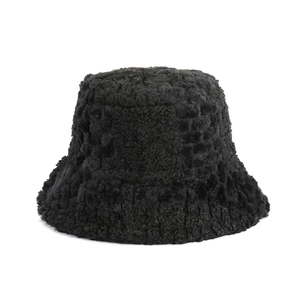 Fashionable black faux fur bucket hat with warm plush lamb wool texture for winter style