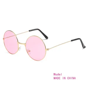 Retro round sunglasses with pink ocean lenses and slim gold metal frame for a hippie style