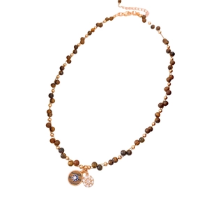 Tiger eye stone zircon necklace with round gold pendants and brown beads on white background