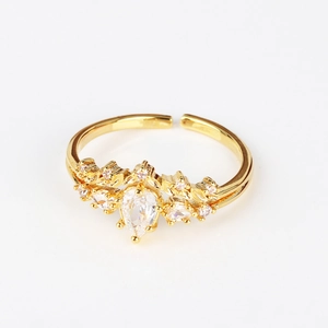 Detailed view of an 18K gold-plated adjustable ring with pear-shaped cubic zirconia
