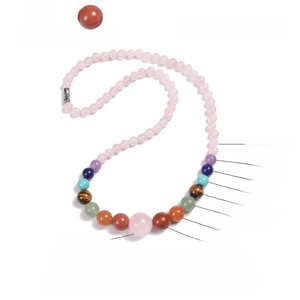 Bohemian colorful natural stone bead necklace with quartz and amethyst on white background
