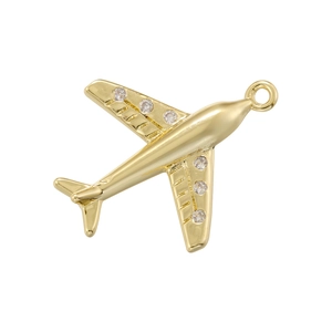 Sparkling gold airplane pendant charm with inlaid clear gemstones on a white background