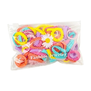 Lot d'élastiques à cheveux colorés macaron dans un sachet marguerite pour enfants