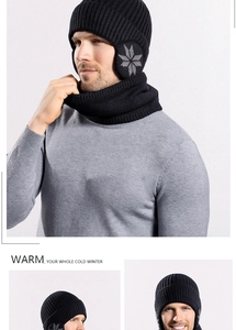 Detail of black winter knit hat and neck warmer set with snowflake pattern and warm lining