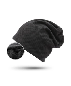 Close-up of black waffle knit hat featuring thick warm fleece lining for winter comfort