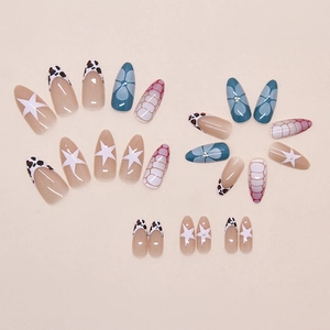 Detailed view of almond shaped press-on nails with leopard and floral patterns