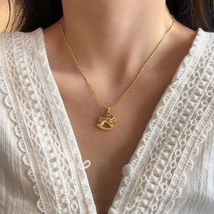 Minimalist 18k gold plated necklace featuring a 3D rocking horse pendant on a delicate chain