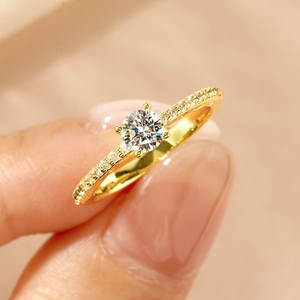 Elegant 14k gold filled moissanite ring shown on finger with sparkling round cut diamond