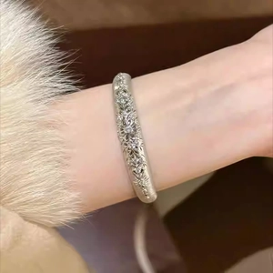 Elegant vintage open bangle with zircon hollow floral patterns and brushed silver finish