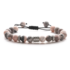 Detail of 8mm pink marble natural stone beads with adjustable black braided cord bracelet
