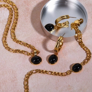 14K gold layered Figaro necklace and earrings set with oval black natural stones
