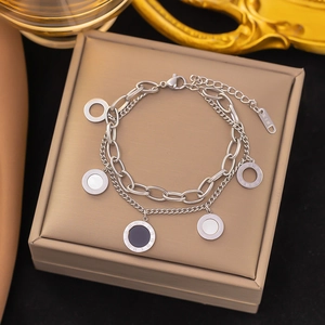 Silver double-layer Roman numeral chain bracelet with black and white disc charms