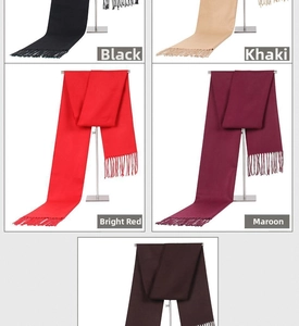 Detail view of solid color men's scarves with tassels in multiple colors and textures