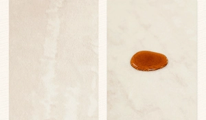 Detalle de alfombra crema que muestra la textura de la tela impermeable y antimanchas