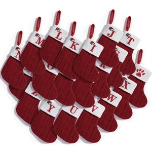 Red knit Christmas stockings with white faux fur cuffs and custom embroidered letters