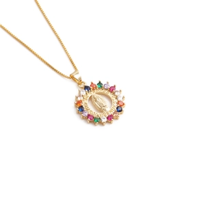 Golden Virgin of Guadalupe pendant necklace with colorful crystals and a box chain