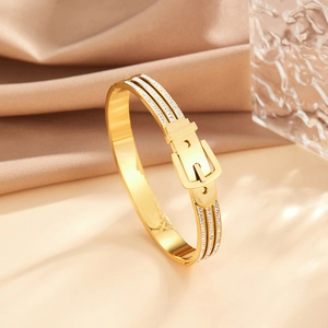 Elegant gold belt buckle bracelet in stainless steel with rows of zircon gemstones