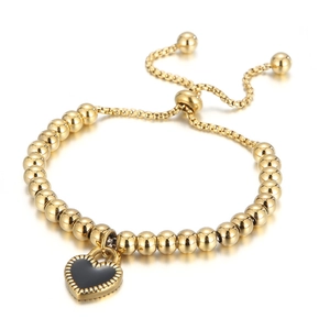 Gold stainless steel beaded bracelet with black enamel heart charm and adjustable slider