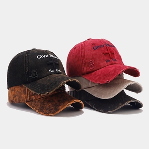 Macro detail of distressed washed cotton baseball cap with vintage embroidery