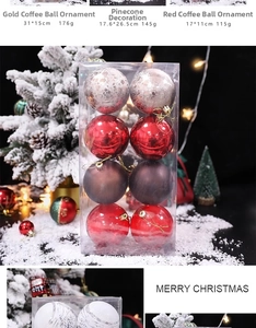 Detailed view of assorted gold and red Christmas baubles in a transparent gift box set