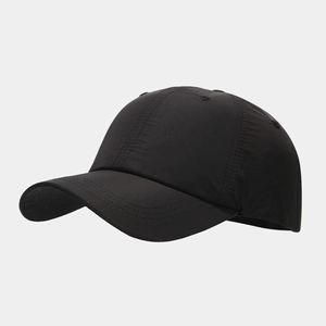 Detail shot of a black waterproof baseball cap showing breathable holes and stitching