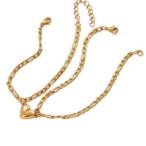 Three gold stainless steel Cuban chain bracelets featuring a magnetic heart-shaped pendant