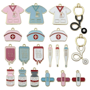 Set of 21 medical enamel charms including nurse uniforms, stethoscopes, and infusion bags
