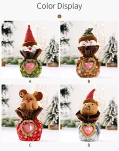 Detail view of four Christmas gift bags with 3D characters and heart-shaped windows