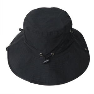 Detail of black wide brim sun hat with adjustable wind cord and metal ventilation holes